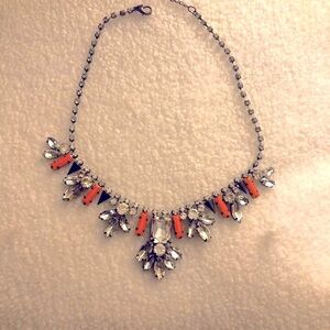 Necklace with peach colored gems